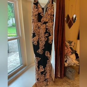 Soieblu black with gold sequins over pink stitching. Sheer upper back and slit